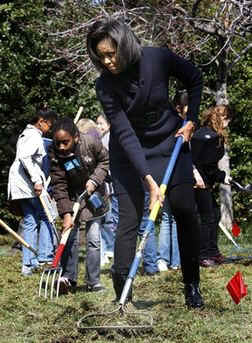 First Lady Michelle Obama plants a White House Kitchen Garden with the help of 5th graders from Bancroft Elementary School in Washington DC. 