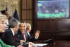President Barack Obama, members of Congress, and local students speak to the astronauts on the International Space Station and the Shuttle Discovery crew from the Roosevelt Room of the White House on March 23, 2009.