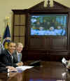 President Barack Obama, members of Congress, and local students speak to the astronauts on the International Space Station and the Shuttle Discovery crew from the Roosevelt Room of the White House on March 23, 2009.