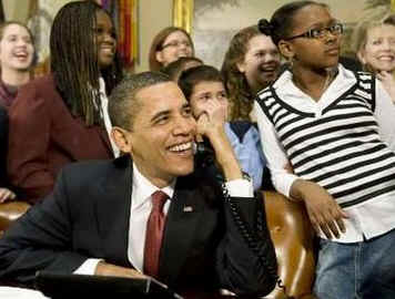 President Barack Obama, members of Congress, and local students speak to the astronauts on the International Space Station and the Shuttle Discovery crew from the Roosevelt Room of the White House on March 23, 2009.
