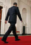 President Obama walks down the Cross Hall after media event. President Obama holds a one-hour live prime time news conference in the East Room of the White House on March 24, 2009.