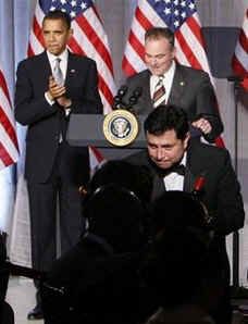 President Barack Obama speaks at a Democratic National Committee fundraiser at the National Women in the Arts Museum in Washington, DC on March 25, 2009. Obama is introduced by DNC Chairman Tim Kaine.