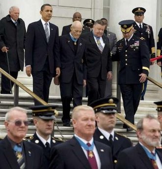 President Barack Obama lays a wreath at the Tomb of the Unknown Soldier, and greets Medal of Honor winners during National Medal of Honor Day at Arlington National Cemetery in Arlington, Virginia on March 25, 2009.
