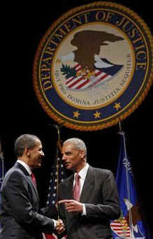 President Barack Obama attends the installation ceremony of US Attorney General Eric Holder at George Washington University.
