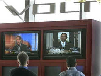 GM emplyees watch President Obama's remarks at GM's Detroit headquarters.