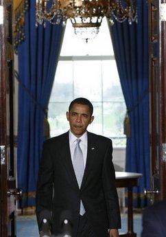 President Barack Obama arrives to speak in the Grand Foyer of the White House on the administration's ongoing plans for the auto industry.