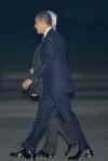 The Obama's were greeted at the airport by Britain's Charge D'affaires Richard LeBaron and his wife Jean, and Chancellor Alistair Darling (photo). 