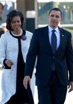 President Barack Obama and First Lady Michelle Obama walk across the South Lawn of the White House to board Marine One for a trip to Andrews Air Force Base where they will depart on Air Force One for a one-week European trip.