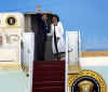 President Barack Obama and First Lady Michelle Obama walk across the South Lawn of the White House to board Marine One for a trip to Andrews Air Force Base where they will depart on Air Force One for a one-week European trip.