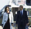 President Barack Obama and First Lady Michelle Obama walk across the South Lawn of the White House to board Marine One for a trip to Andrews Air Force Base where they will depart on Air Force One for a one-week European trip.
