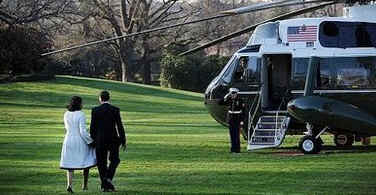 President Barack Obama and First Lady Michelle Obama walk across the South Lawn of the White House to board Marine One for a trip to Andrews Air Force Base where they will depart on Air Force One for a one-week European trip.