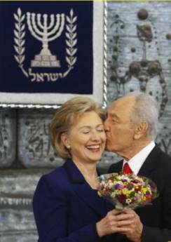 Secretary of State Hillary Clinton gets a kiss from Israeli President Shimo Peres in Jerusalem on March 3, 2009.