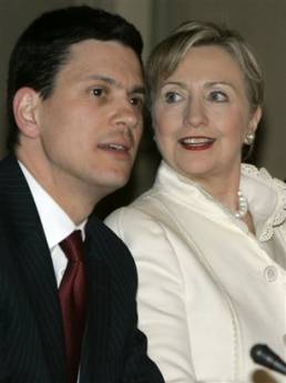 Secretary of State Hillary Clinton arrives in Brussels for dinner at the Egmont Palace with NATO and European Union foreign ministers. Clinton is seated next to UK Foreign Minister Miliband.