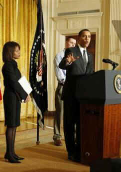 Domestic Policy adviser Melody Barnes and President Obama speak at the start of a White House conference on Health Care Reform.