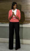 First Lady Michelle Obama waits to speaks at Miriam's Kitchen.