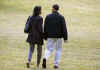 President Barack Obama and First Lady Michelle Obama walk across the South Lawn of the White House holding hands as they depart for an overnight stay with family at the presidential retreat at Camp David on March 7, 2009.