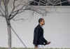 President Barack Obama walks on the West Wing Colonnade of the White House before departing for an overnight stay with family at the presidential retreat at Camp David on March 7, 2009.
