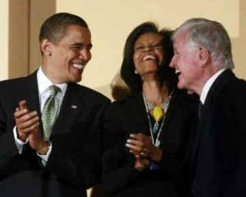 President Barack Obama, First Lady Michelle Obama, and Vice President Joe Biden attend the Celebration Concert for Senator Edward Kennedy's 77th Birthday at the Kennedy Center in Washington, DC on March 8, 2009.