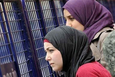 President Barack Obama's motorcade leaves the Hagia Sophia in Istanbul, Turkey on April 7, 2009 under the watchful gaze of two Muslim girls.