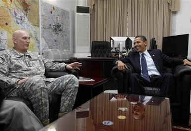President Barack Obama meets with General Ray Odierno and National Security Advisor James Jones at Camp Victory.