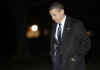 President Obama walks across the South Lawn of the White House in the early hours.