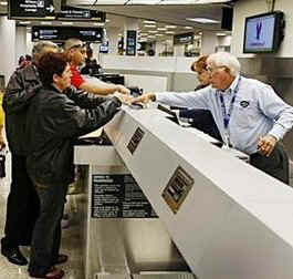 President Barack Obama announces new plans to ease travel to Cuba and changes in financial policies towards Cuba. Photo: Cuban Americans at an American Eagle at Miami International Airport counter for a flight to Cuba.