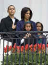 The singer Fergie sang the national anthem and entertained the crowd. President Barack Obama and First Lady Michelle Obama speak to a crowd of about 3,000 from the Truman Balcony at the White House.