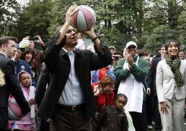 President Barack Obama took some time away from the traditional White House Easter Egg Roll to throw a few basketball hoops with the Easter Monday crowd on the White House grounds on April 13, 2009. 