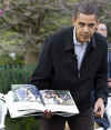 President Obama reads and acts out from the book 'Where the Wild Things Are' to a group of children.