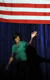 First Lady Michelle Obama waves after speaking at the Department of Homeland Security