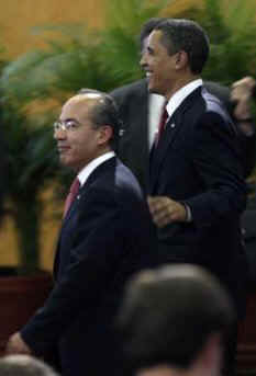 President Obama and President Calderon walk after a joint press conference.