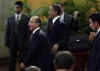 President Obama and President Calderon walk after a joint press conference.