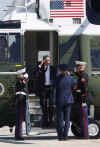 President Barack Obama leaves the Oval Office of the White House to board Marine One.