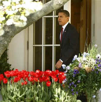 President Barack Obama leaves the Oval Office of the White House to board Marine One.