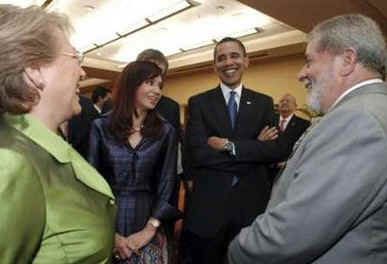 President Obama talks to Chilean President Bachelet and Brazil's President Luiz Inacio Lula da Silva.