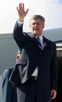 Canadian Prime Minister Stephen Harper waits on the tarmac in his Canadian Forces jet for 45 minutes while President Obama lands and disembarks Air Force One in Trinidad & Tobago on April 18, 2009.