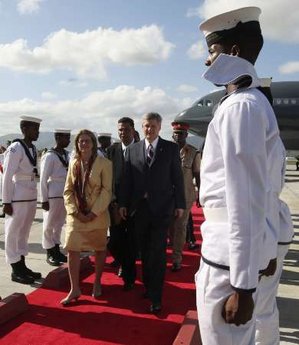 Canadian Prime Minister Stephen Harper waits on the tarmac in his Canadian Forces jet for 45 minutes while President Obama lands and disembarks Air Force One in Trinidad & Tobago on April 18, 2009.