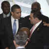 President Barack Obama greets El Salvador's President Tony Saca and other summit leaders prior to the official photo of the Heads of State.