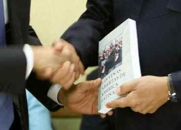 President Obama is given a book prior to the start of the meeting by Venezuelan President Hugo Chavez. The book written in Spanish is titled The Open Veins of Latin America.