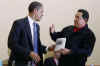 President Obama is given a book prior to the start of the meeting by Venezuelan President Hugo Chavez. The book written in Spanish is titled The Open Veins of Latin America.