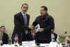 President Obama is given a book prior to the start of the meeting by Venezuelan President Hugo Chavez. The book written in Spanish is titled The Open Veins of Latin America.