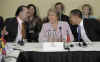 President Barack Obama attends the UNASR countries meeting on April 18, 2009 in Port of Spain, Trinidad and Tobago. Obama sits next to Chilean President Bachelet. 