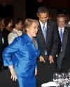 President Obama played the gentleman and assisted Chile's President Bachelet to her seat.