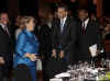 President Obama played the gentleman and assisted Chile's President Bachelet to her seat.