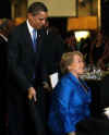 President Obama played the gentleman and assisted Chile's President Bachelet to her seat.