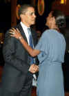 President Obama met the wife of the Belize PM Kim Simplis-Barrow and assisted her to her seat.