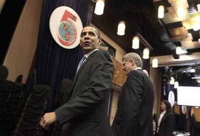 President Barack Obama arrives with Canadian Prime Minister Stephen Harper on the second day of the 5th Summit.