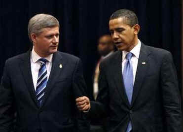 President Barack Obama arrives with Canadian Prime Minister Stephen Harper on the second day of the 5th Summit.