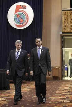 President Barack Obama arrives with Canadian Prime Minister Stephen Harper on the second day of the 5th Summit.