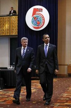 President Barack Obama arrives with Canadian Prime Minister Stephen Harper on the second day of the 5th Summit.